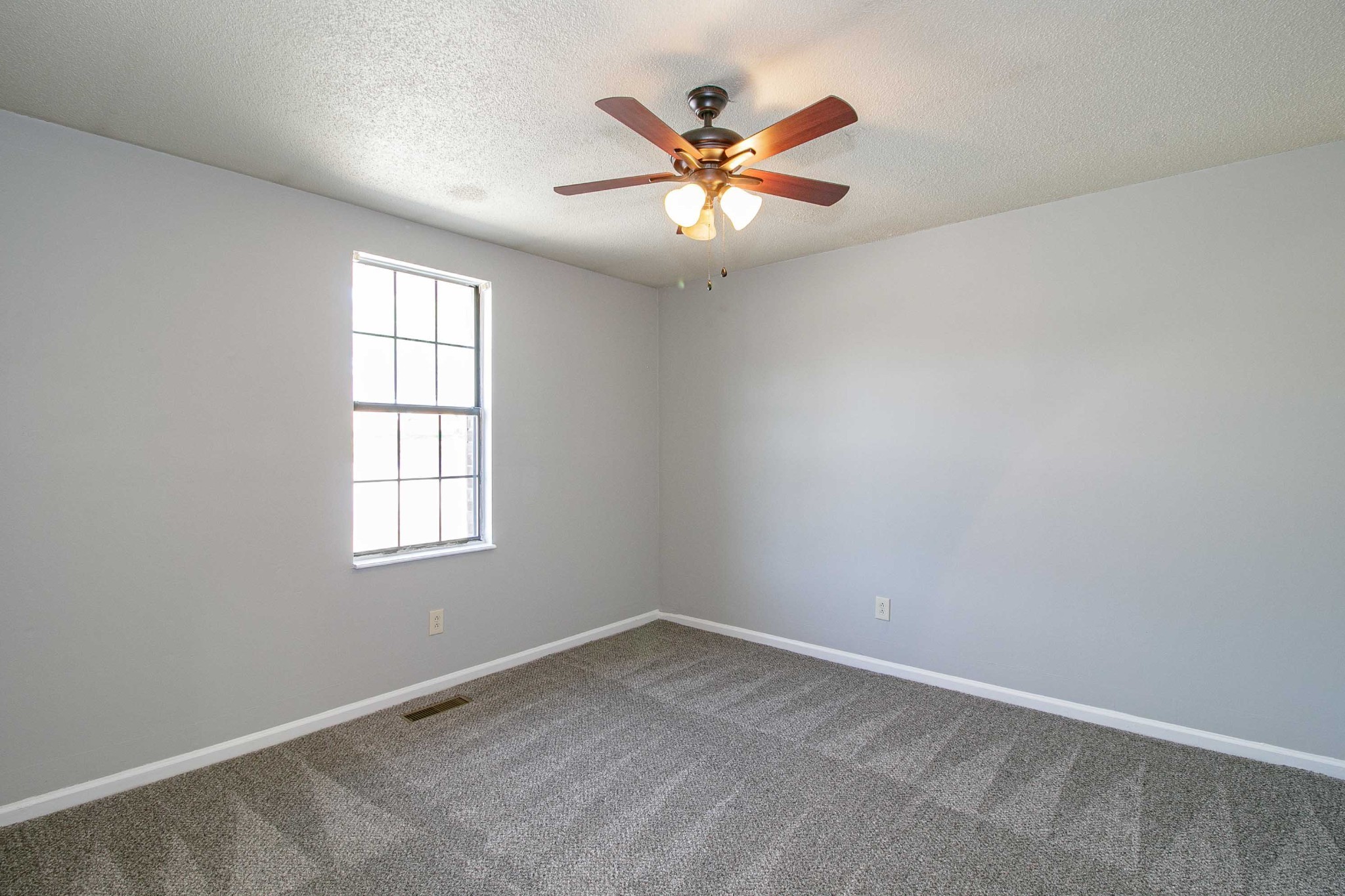1088 Mcdaniel Road Clarksville, TN 37043 - Photo 36 of 71 an empty room with window and ceiling fan