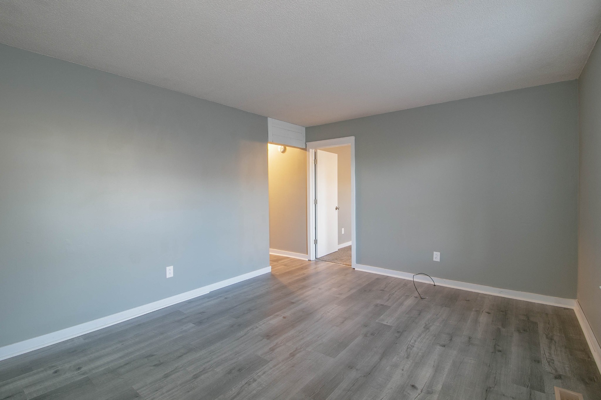 1088 Mcdaniel Road Clarksville, TN 37043 - Photo 40 of 71 a view of an empty room with wooden floor and a window