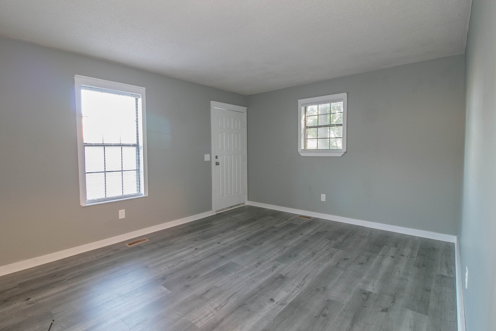 1088 Mcdaniel Road Clarksville, TN 37043 - Photo 43 of 71 an empty room with wooden floor and windows
