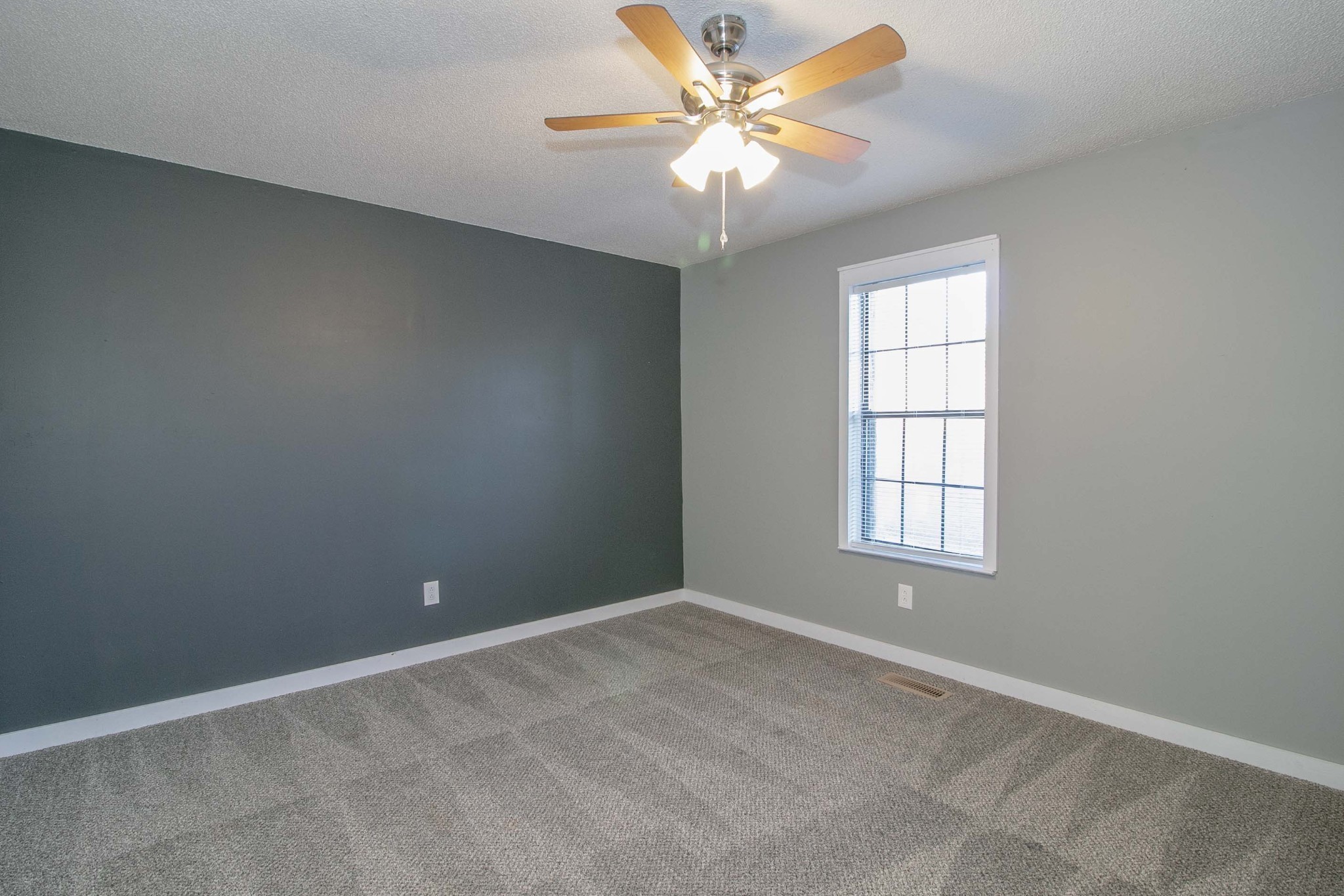 1088 Mcdaniel Road Clarksville, TN 37043 - Photo 44 of 71 an empty room with a window and a fan