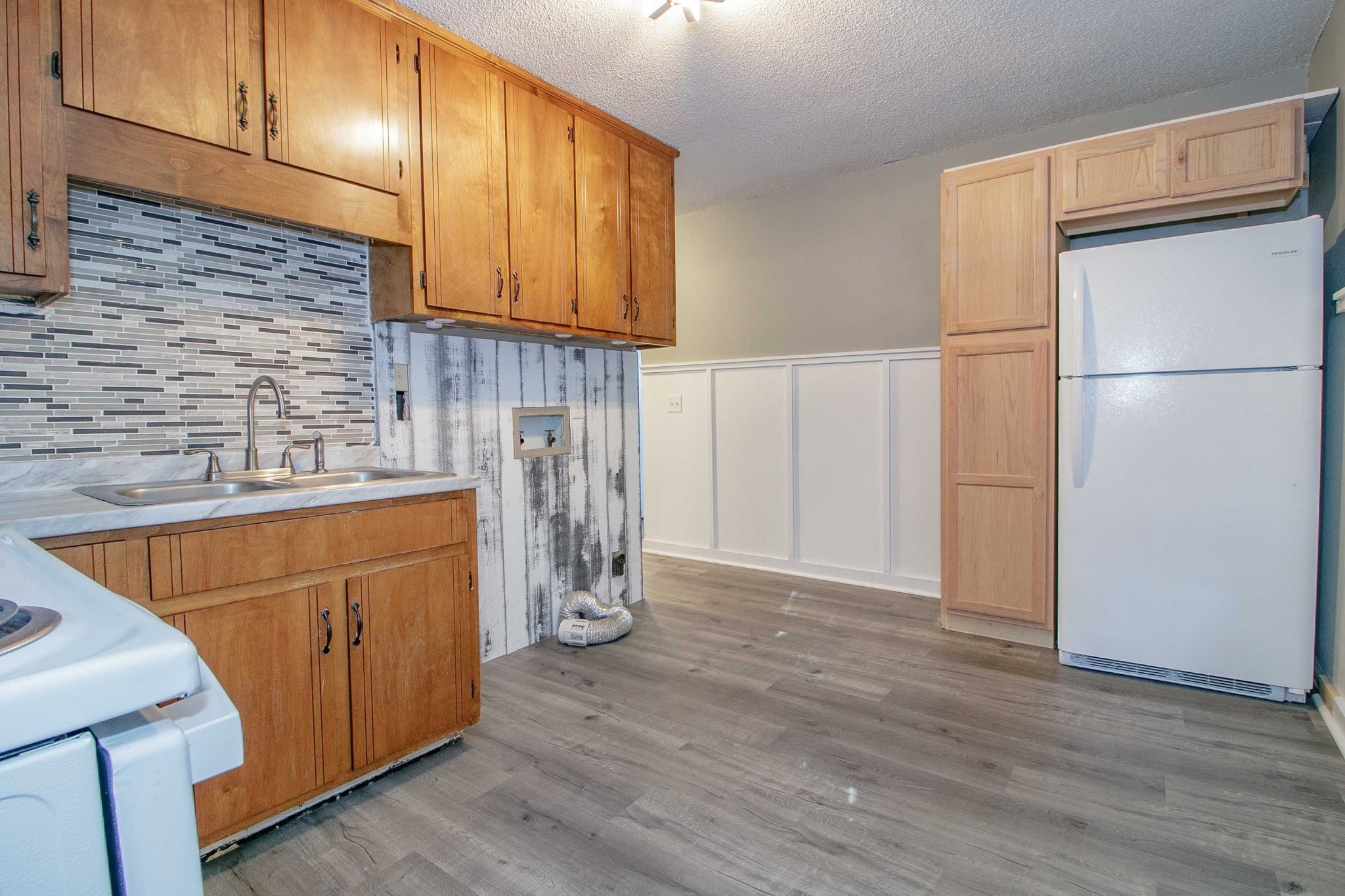 1088 Mcdaniel Road Clarksville, TN 37043 - Photo 53 of 71 a kitchen with stainless steel appliances granite countertop a refrigerator sink and cabinets
