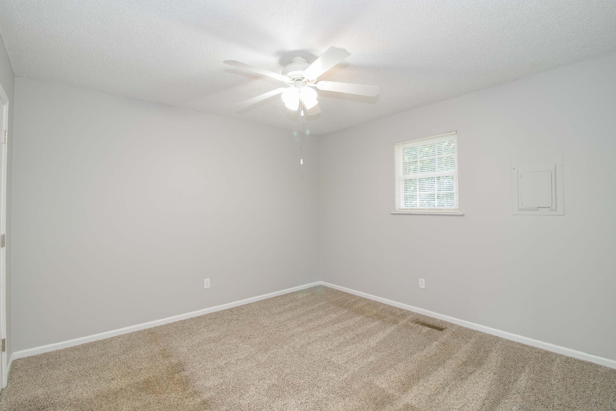 1088 Mcdaniel Road Clarksville, TN 37043 - Photo 62 of 71 an empty room with a window and a fan