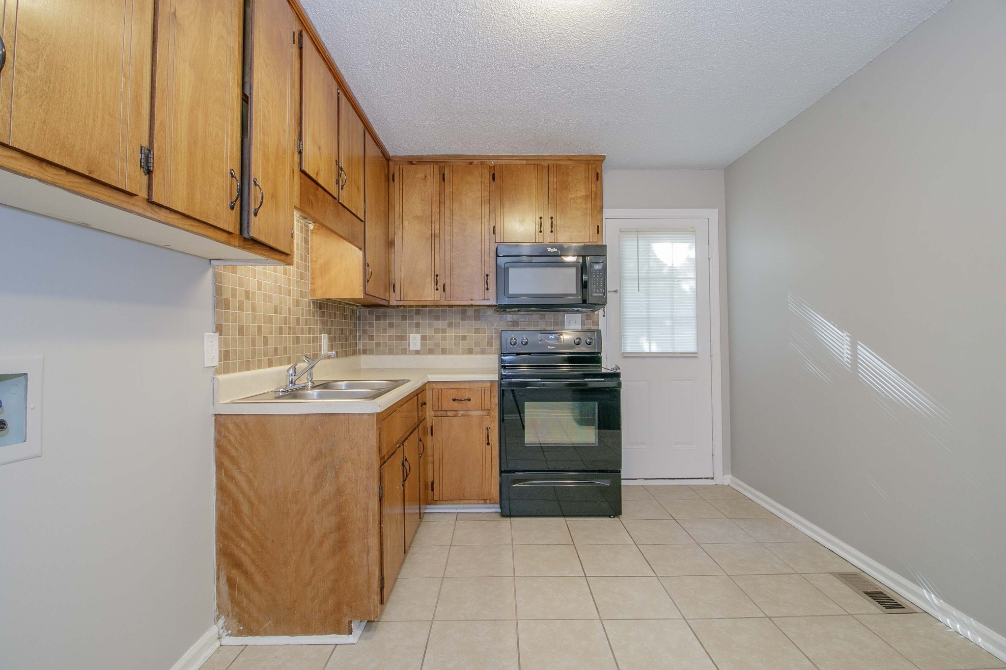 1088 Mcdaniel Road Clarksville, TN 37043 - Photo 69 of 71 a kitchen with a sink cabinets and appliances
