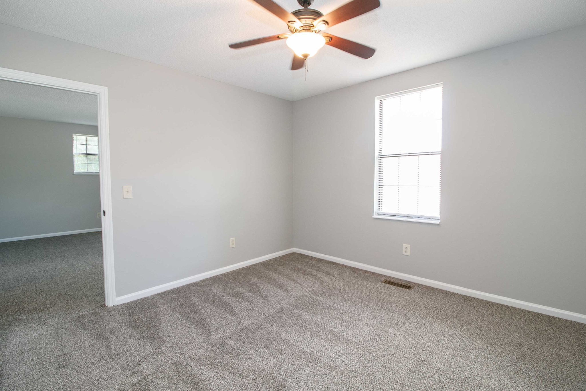 1088 Mcdaniel Road Clarksville, TN 37043 - Photo 10 of 71 an empty room with a window and a fan