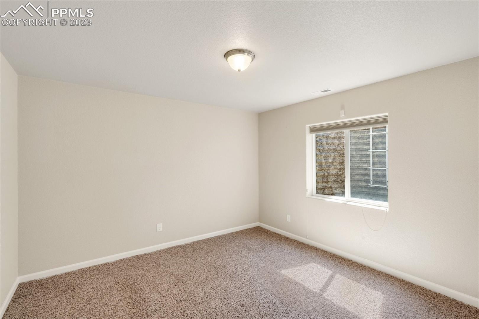 7040 Red Cardinal Loop Colorado Springs, CO 80908 - Photo 18 of 28 Basement Bedroom #3