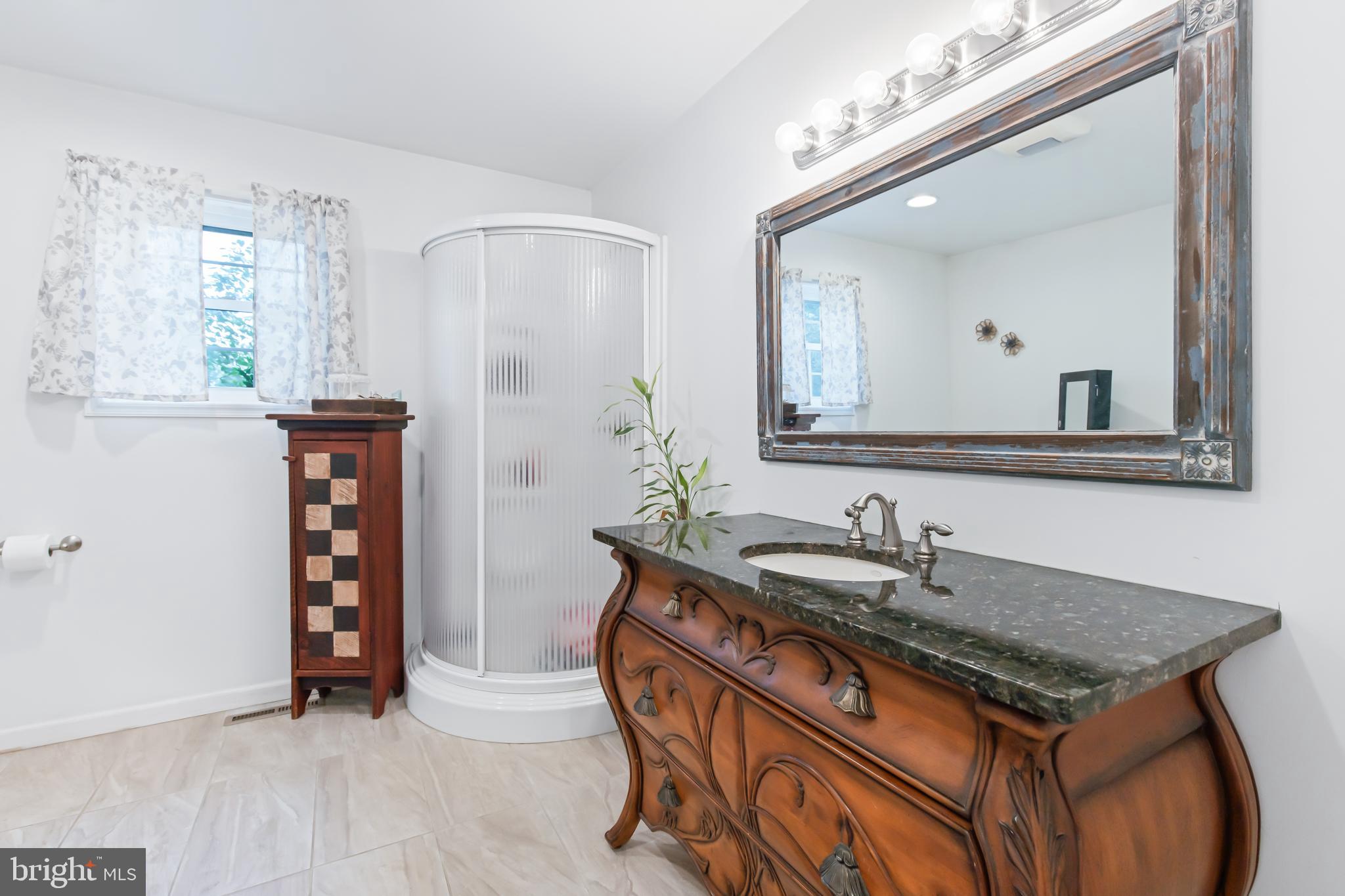 259 Little Britain Road Nottingham, PA 19362 - Photo 20 of 49 Primary bathroom with shower and vanity