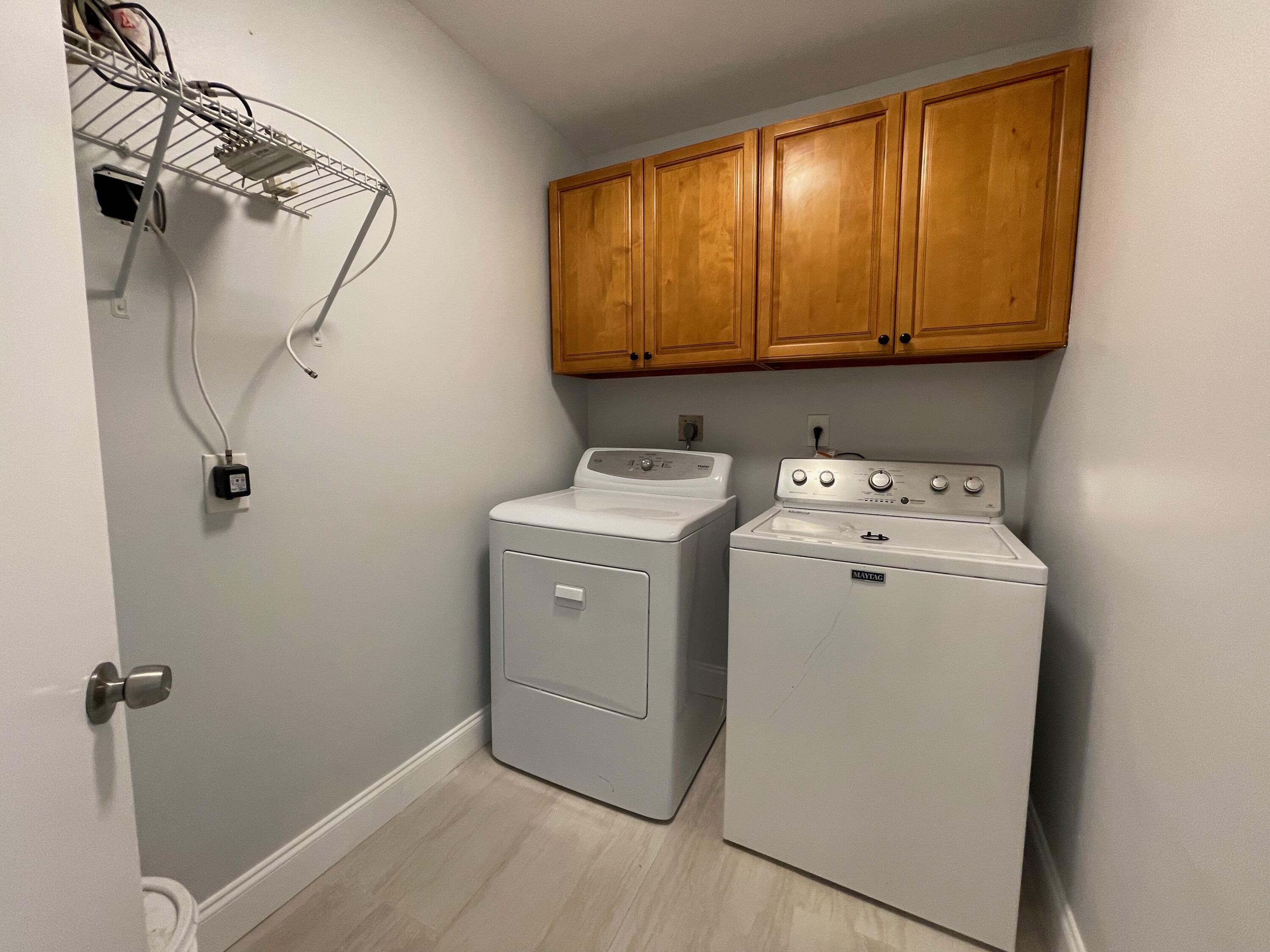 6691 Montego Bay Boulevard, Unit H Boca Raton, FL 33433 - Photo 19 of 22 a utility room with dryer and washer