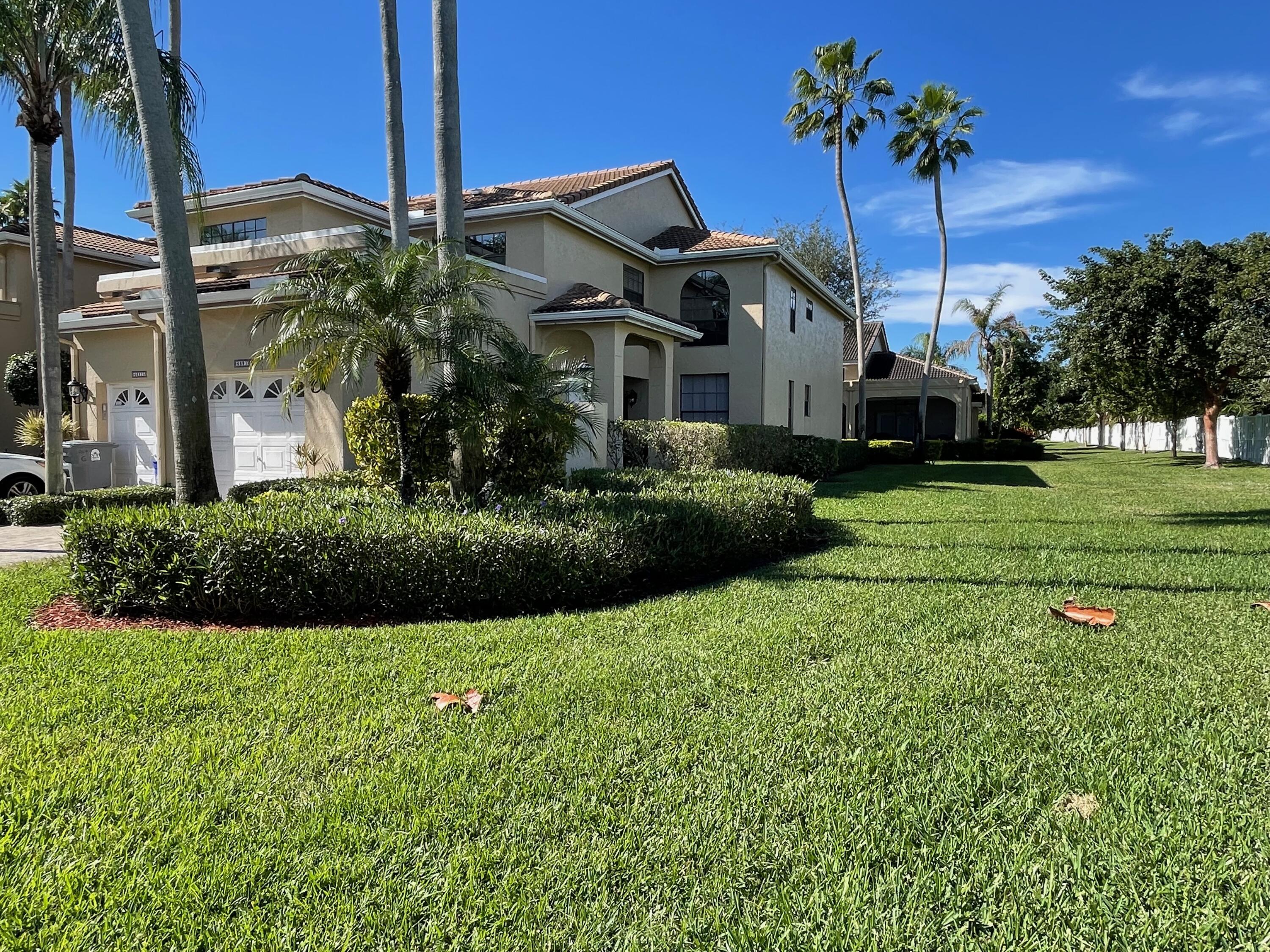 6691 Montego Bay Boulevard, Unit H Boca Raton, FL 33433 - Photo 22 of 22 a front view of a house with garden