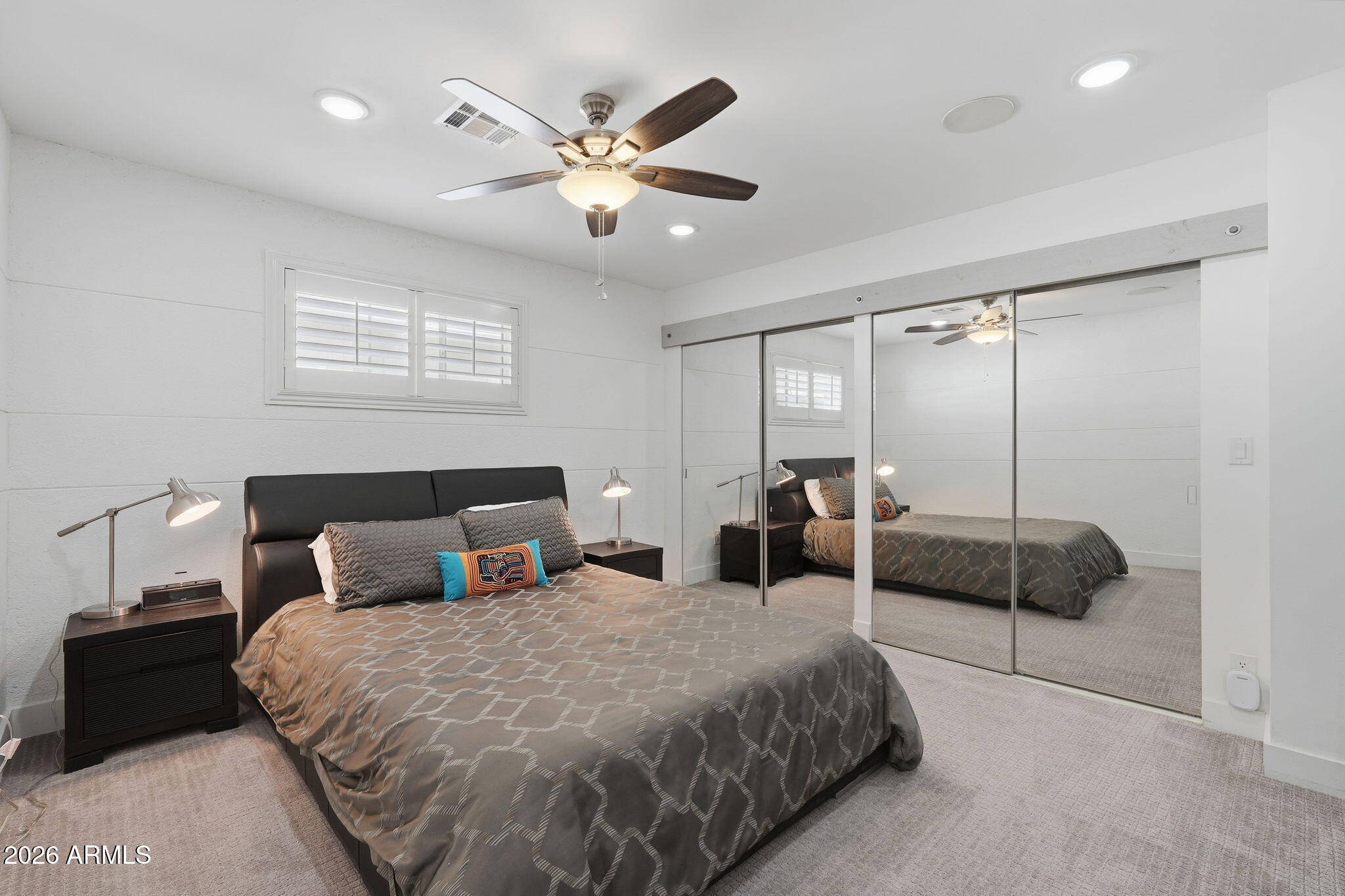 5149 North 34th Street Phoenix, AZ 85018 - Photo 45 of 70 a bedroom with a large bed and a chandelier