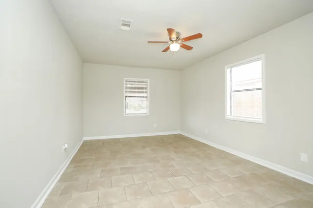 a view of an empty room with a window