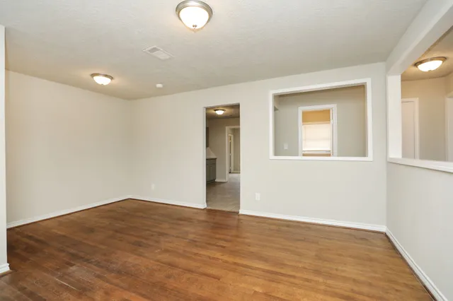 a view of a small space with wooden floor