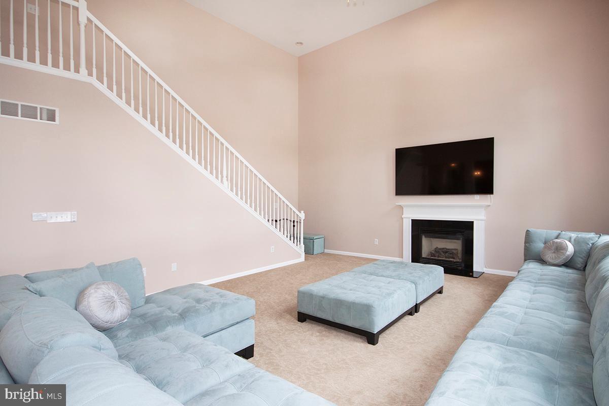 17 Ragan Ridge Road Sicklerville, NJ 08081 - Photo 19 of 57 Family Room: Gas Fireplace. Back Stairs