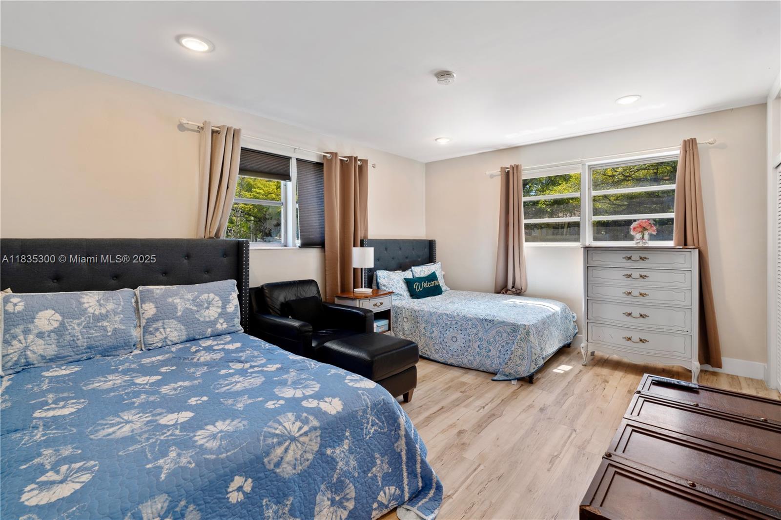 4025 Washington Street Hollywood, FL 33021 - Photo 11 of 24 a bedroom with a bed and wooden floor