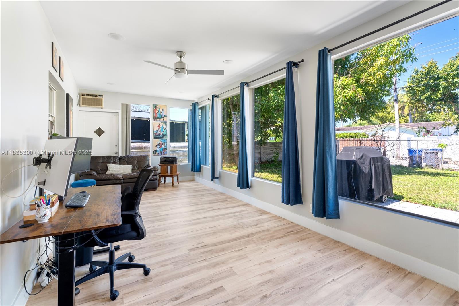 4025 Washington Street Hollywood, FL 33021 - Photo 14 of 24 a view of a dining room with furniture window and wooden floor