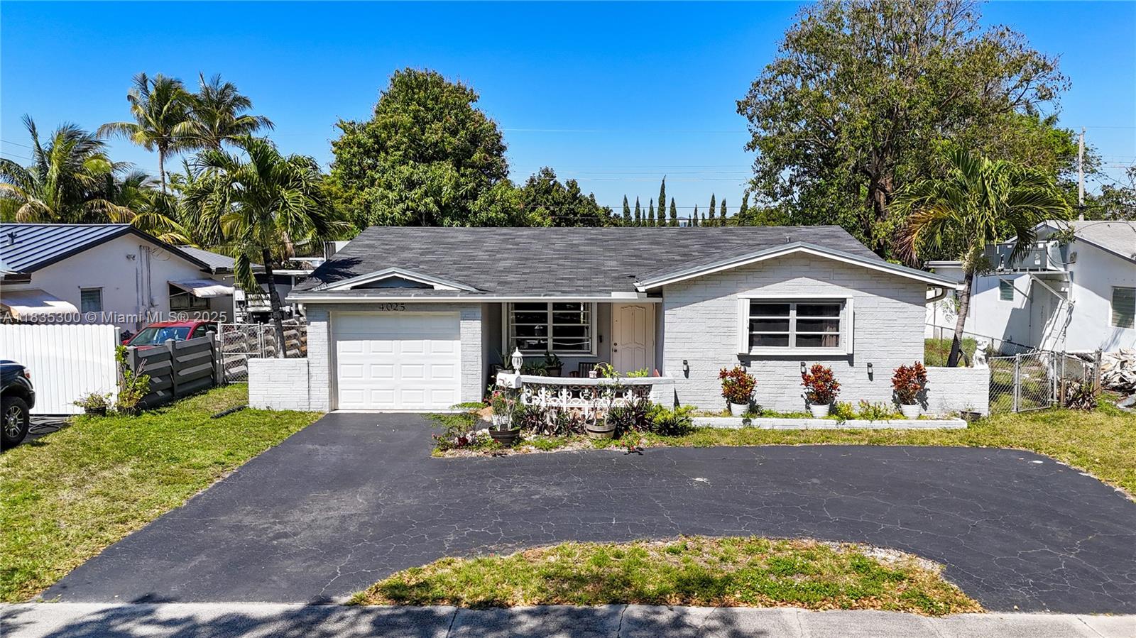 4025 Washington Street Hollywood, FL 33021 - Photo 17 of 24 a front view of house with yard outdoor seating and green space