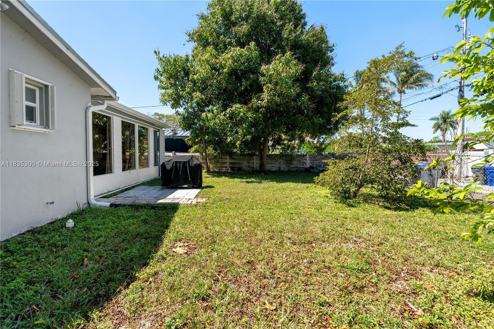 4025 Washington Street Hollywood, FL 33021 - Photo 18 of 24 a front view of a house with garden