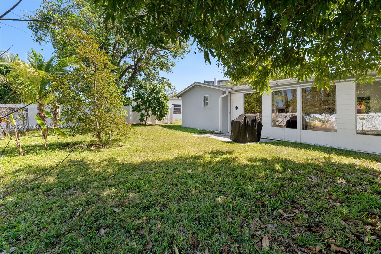 4025 Washington Street Hollywood, FL 33021 - Photo 19 of 24 a view of a house with a yard and large tree