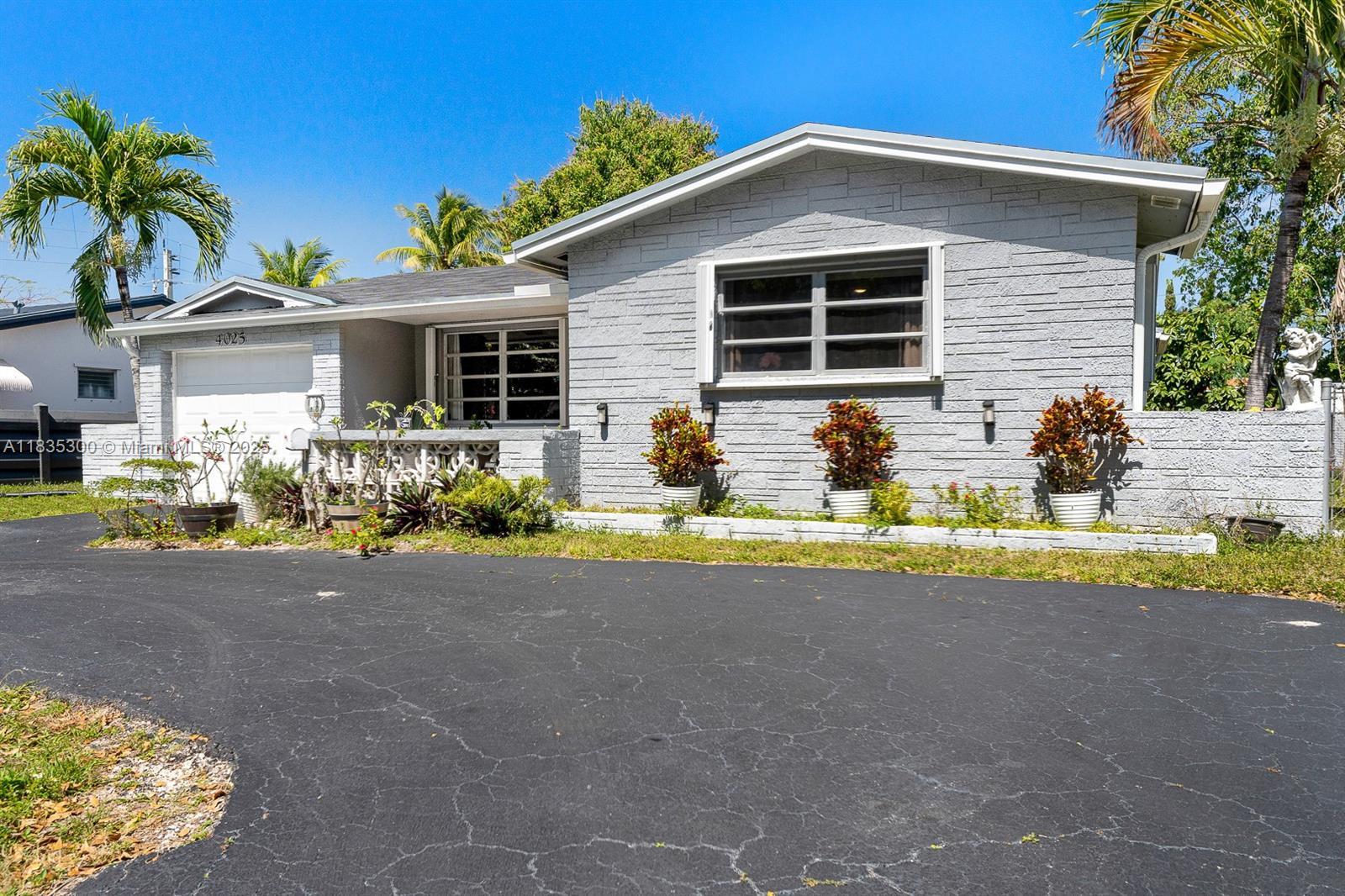 4025 Washington Street Hollywood, FL 33021 - Photo 20 of 24 a front view of a house with patio
