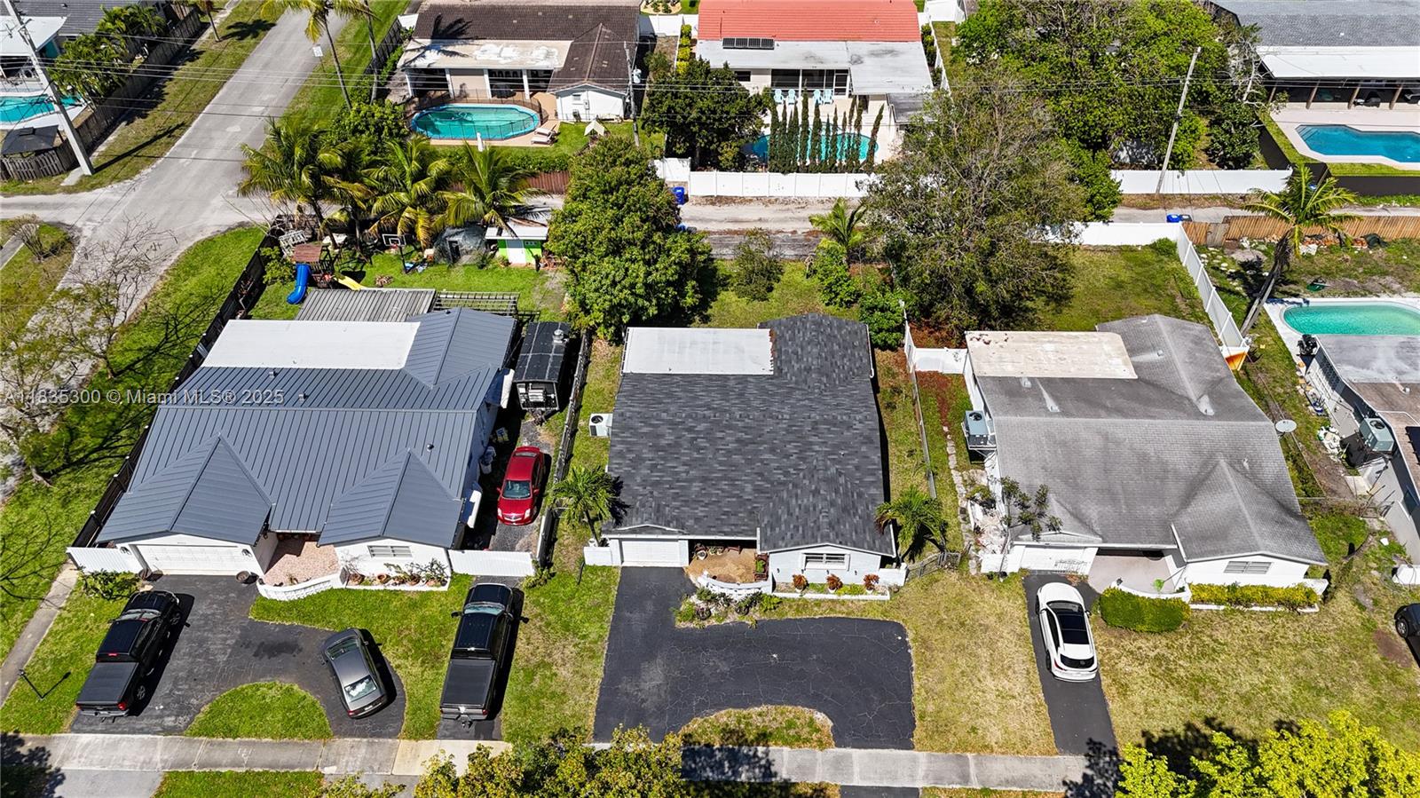 4025 Washington Street Hollywood, FL 33021 - Photo 24 of 24 an aerial view of multiple houses with yard