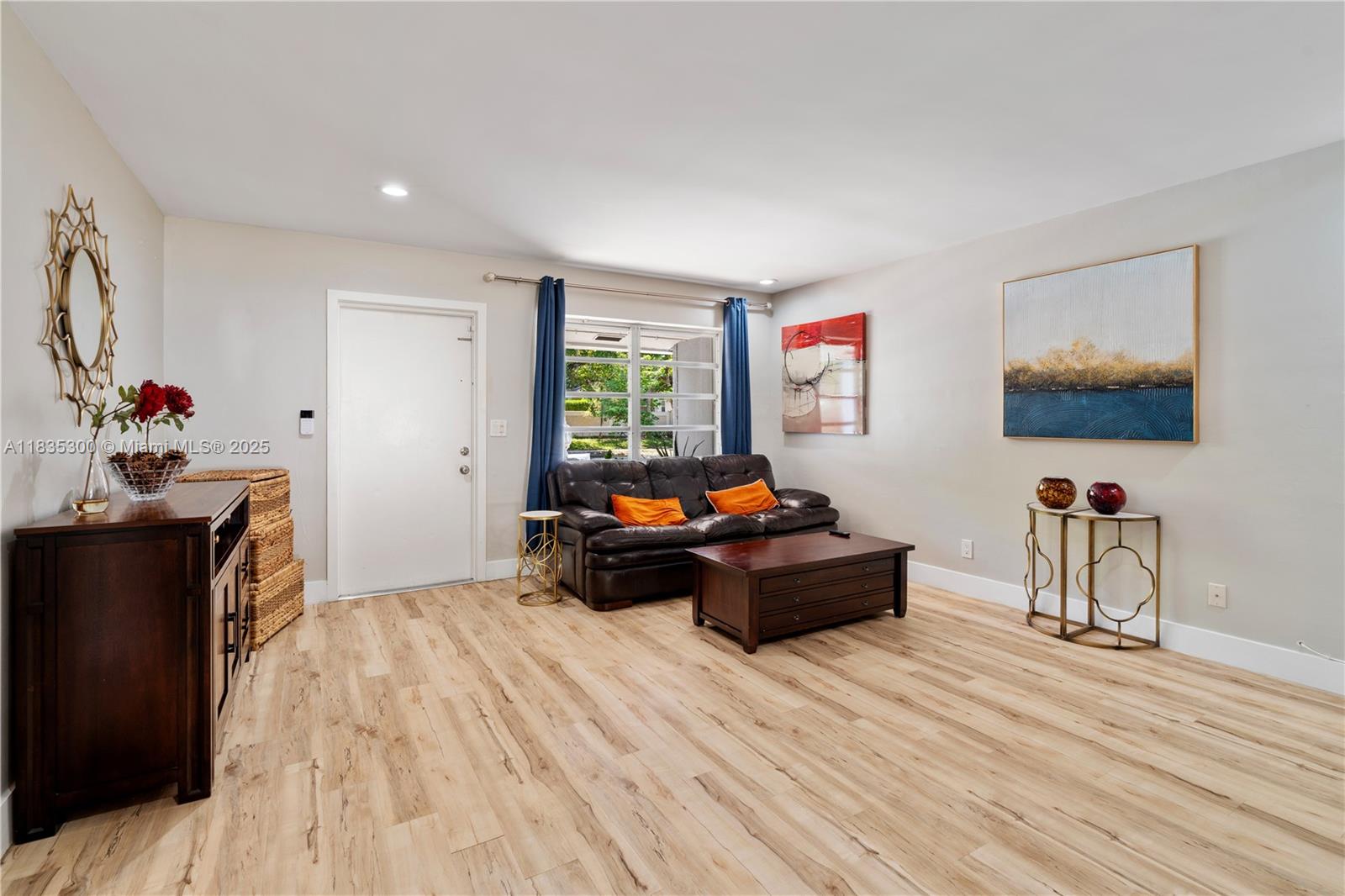 4025 Washington Street Hollywood, FL 33021 - Photo 3 of 24 a living room with furniture and a flat screen tv