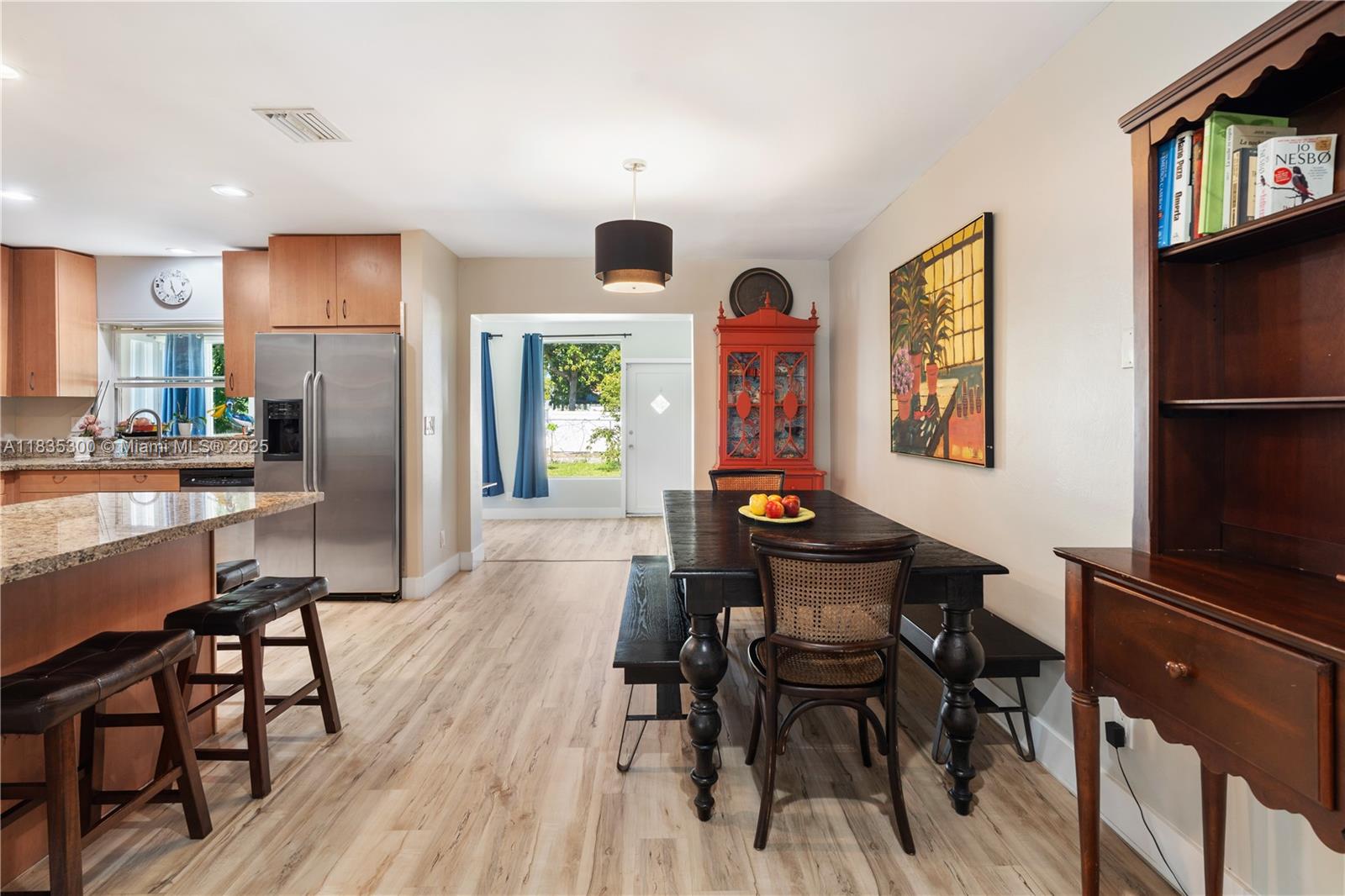 4025 Washington Street Hollywood, FL 33021 - Photo 4 of 24 a view of a dining room with furniture window and wooden floor