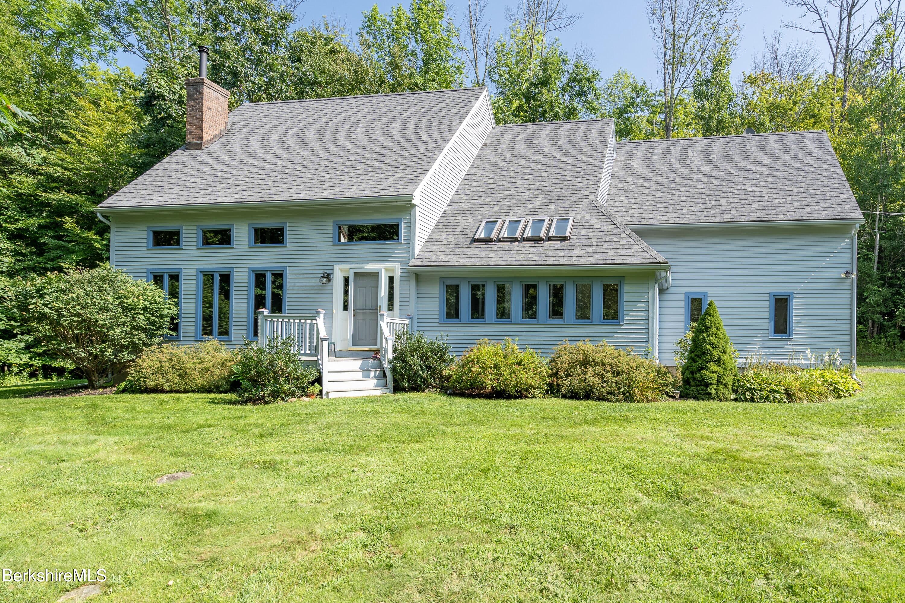 161 Capt Whitney Road Becket, MA 01223 - Photo 2 of 29 a view of house with garden