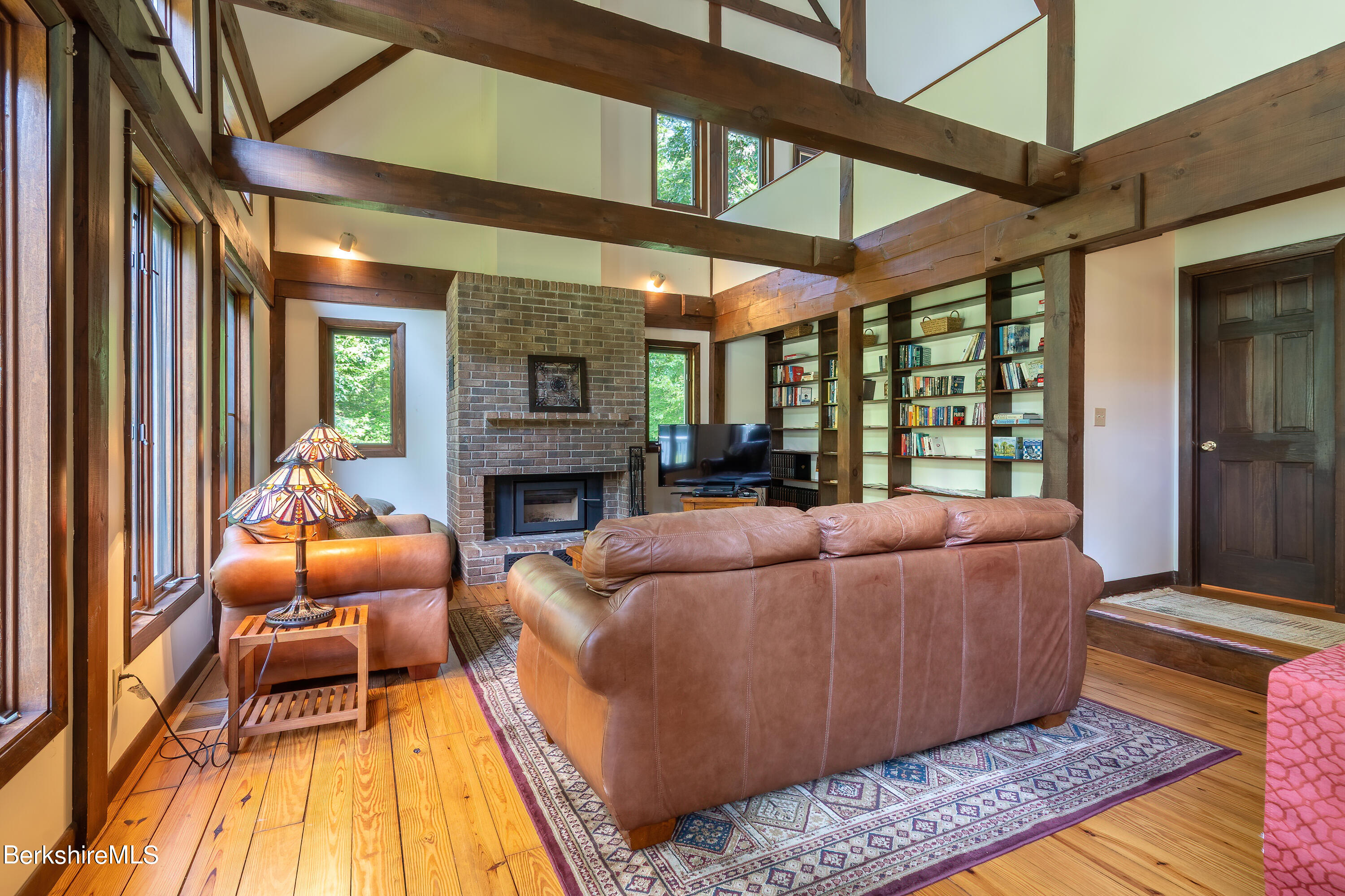 161 Capt Whitney Road Becket, MA 01223 - Photo 3 of 29 a living room with furniture and a fireplace