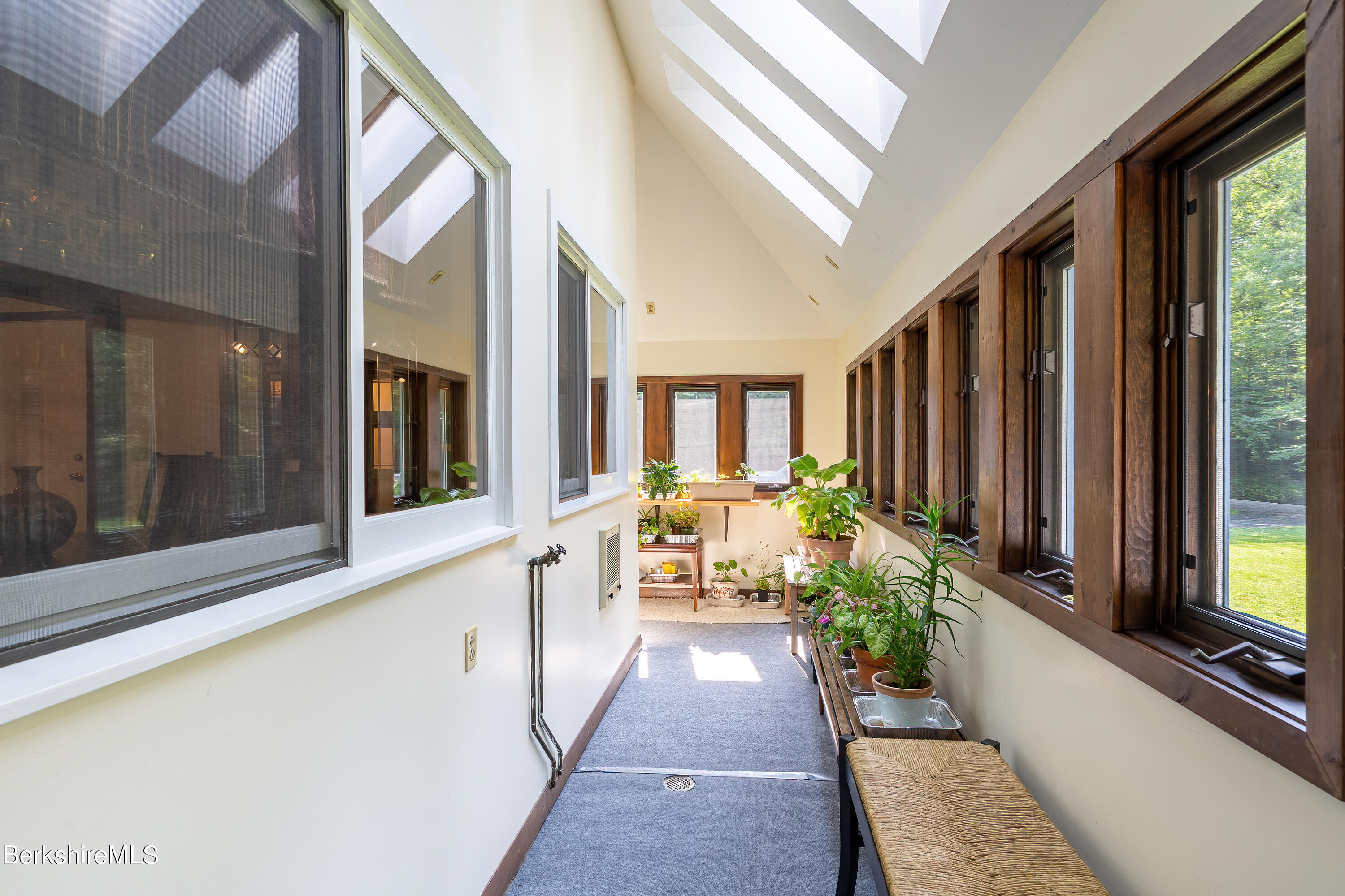 161 Capt Whitney Road Becket, MA 01223 - Photo 25 of 29 a hall way with furniture and floor to ceiling window