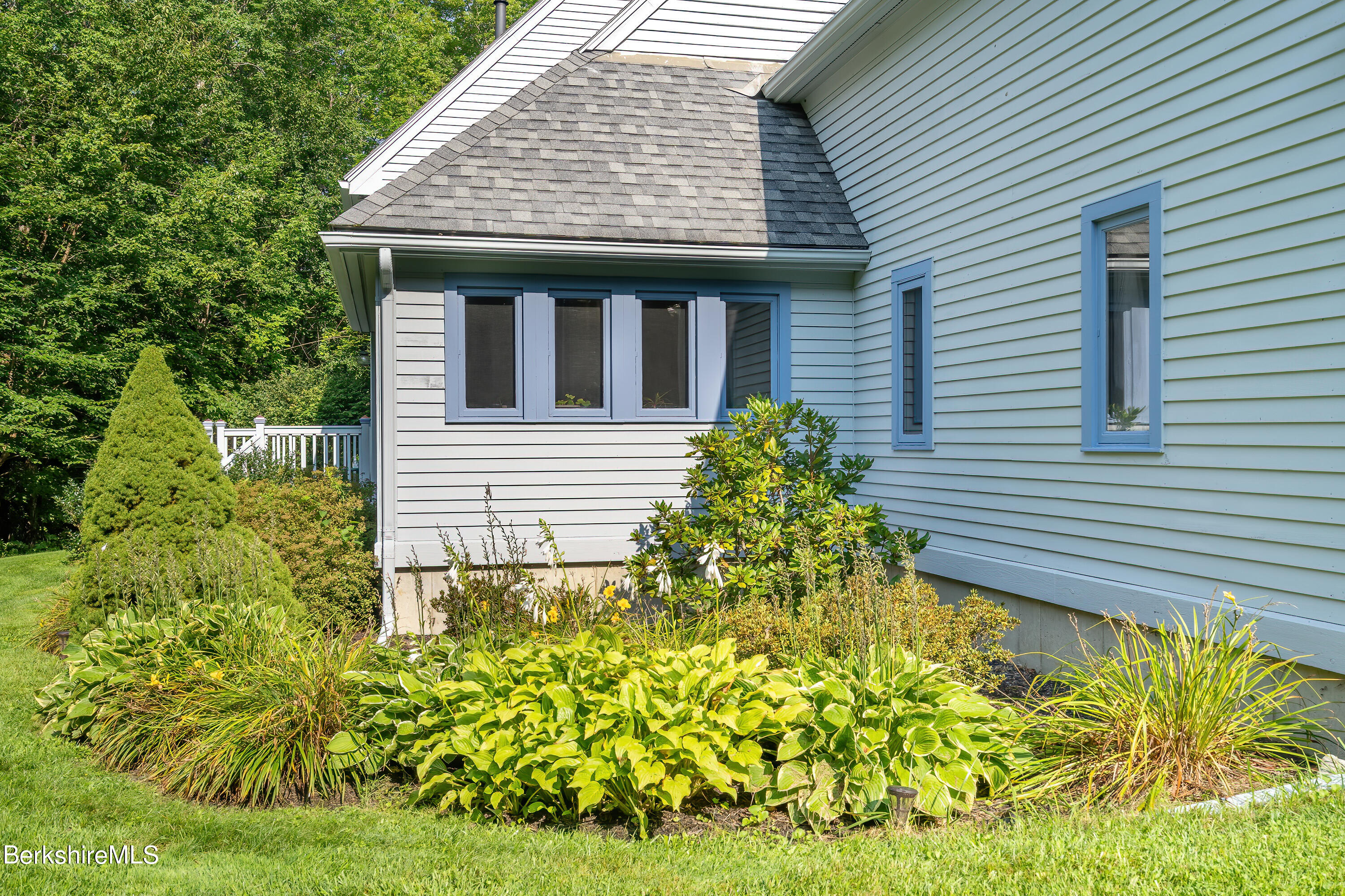 161 Capt Whitney Road Becket, MA 01223 - Photo 26 of 29 a front view of a house with a yard