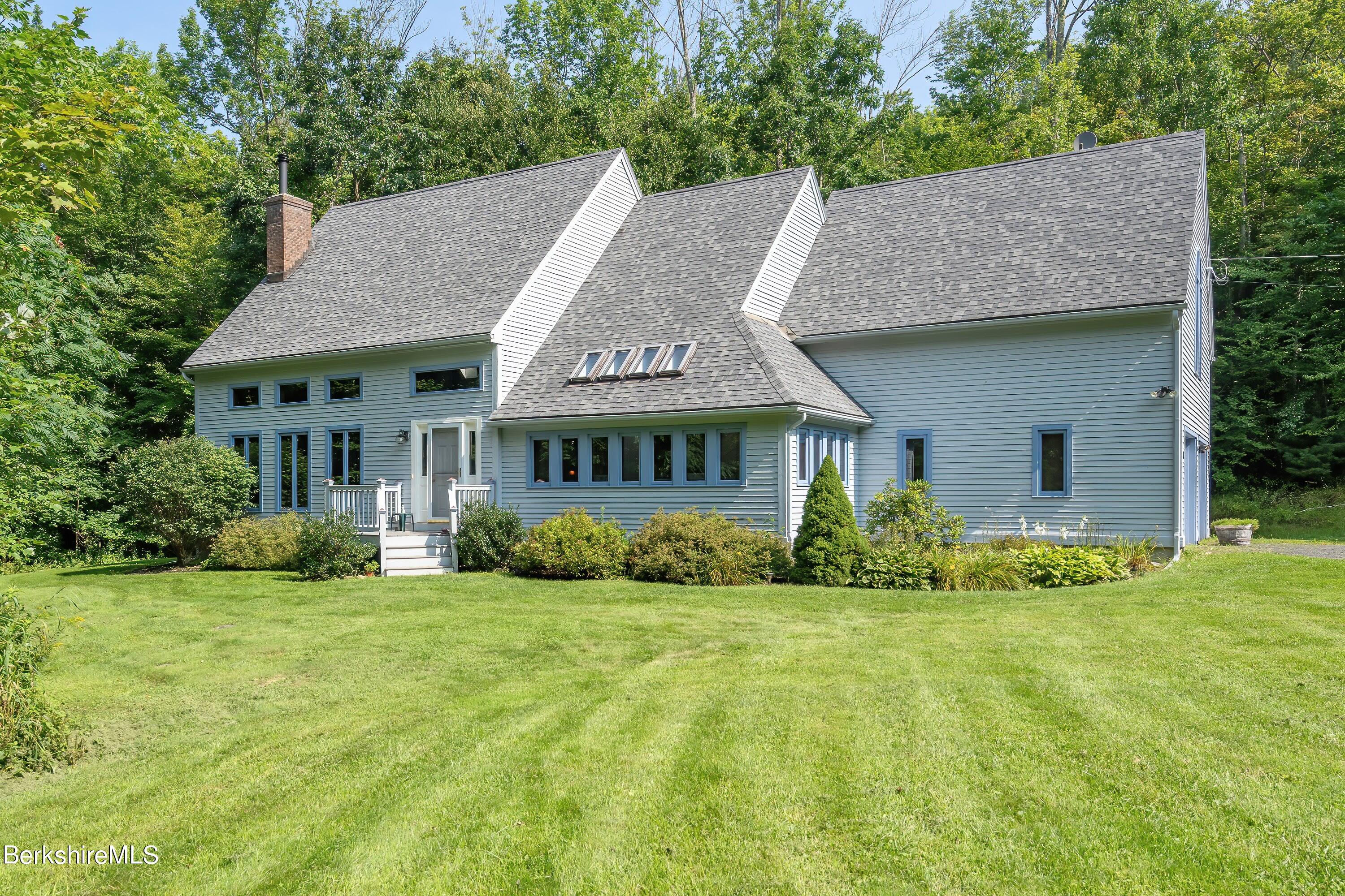 161 Capt Whitney Road Becket, MA 01223 - Photo 27 of 29 a view of house with yard and green space