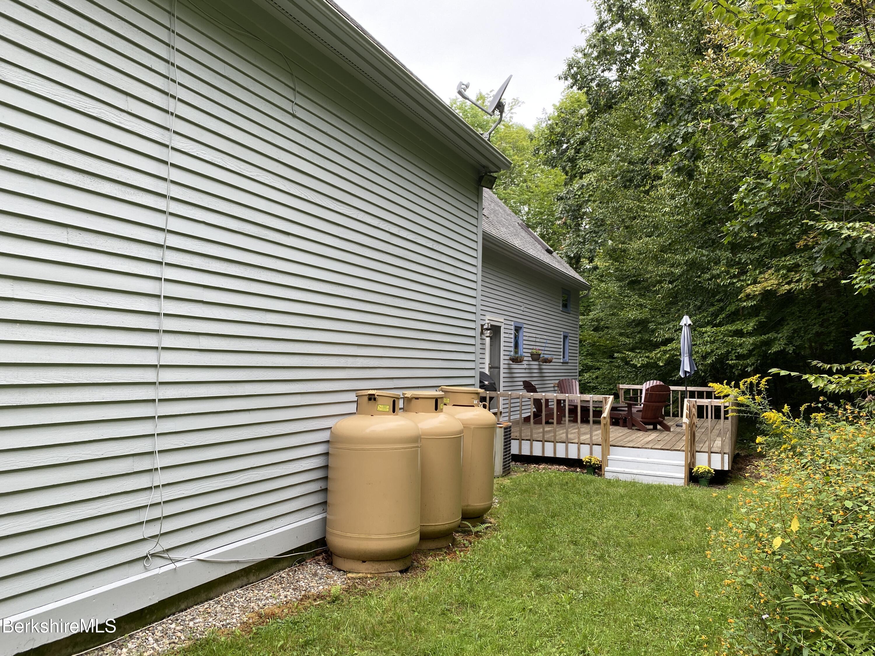 161 Capt Whitney Road Becket, MA 01223 - Photo 29 of 29 a view of a patio with chairs and table in it