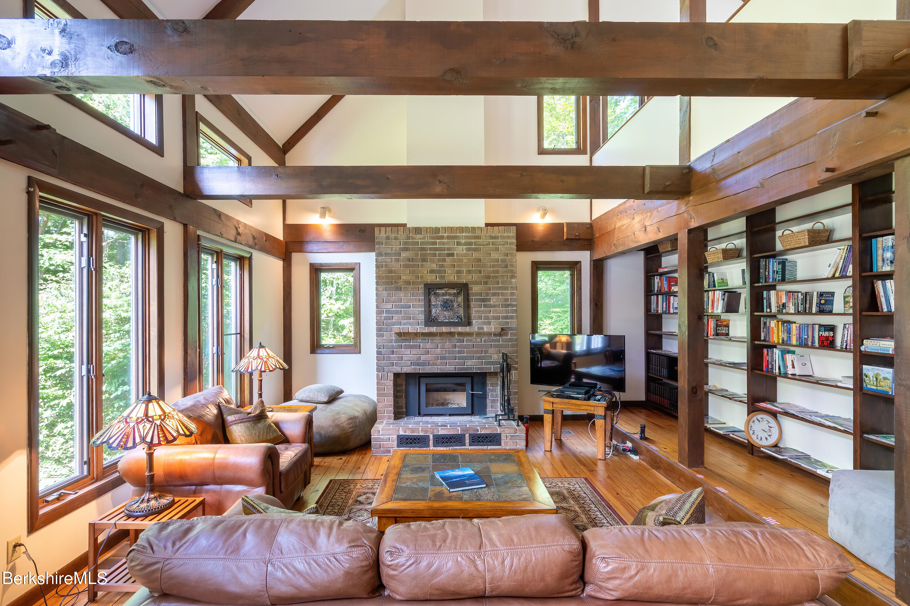 161 Capt Whitney Road Becket, MA 01223 - Photo 5 of 29 a living room with furniture and a fireplace
