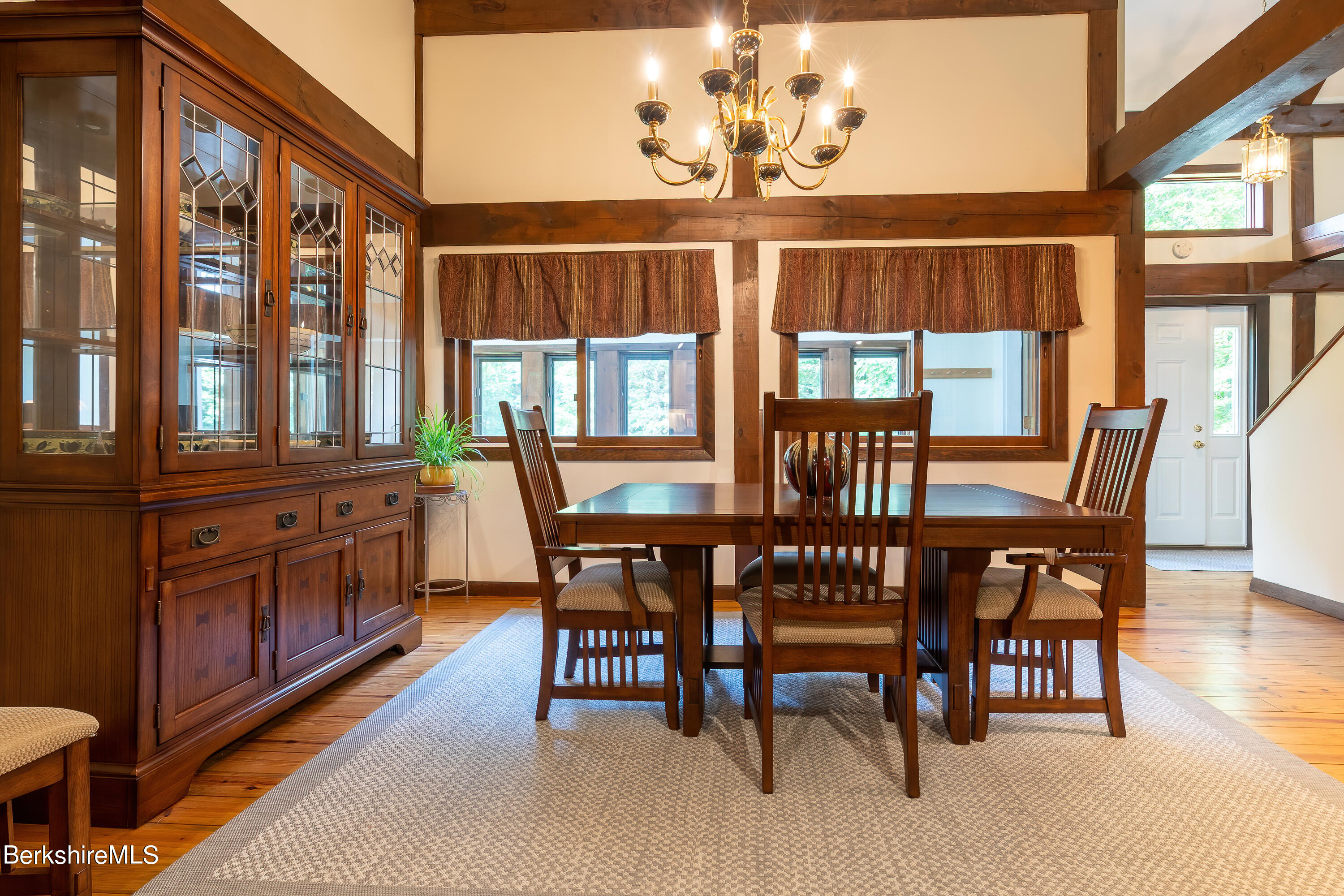 161 Capt Whitney Road Becket, MA 01223 - Photo 7 of 29 a view of a dining room with furniture a chandelier and wooden floor