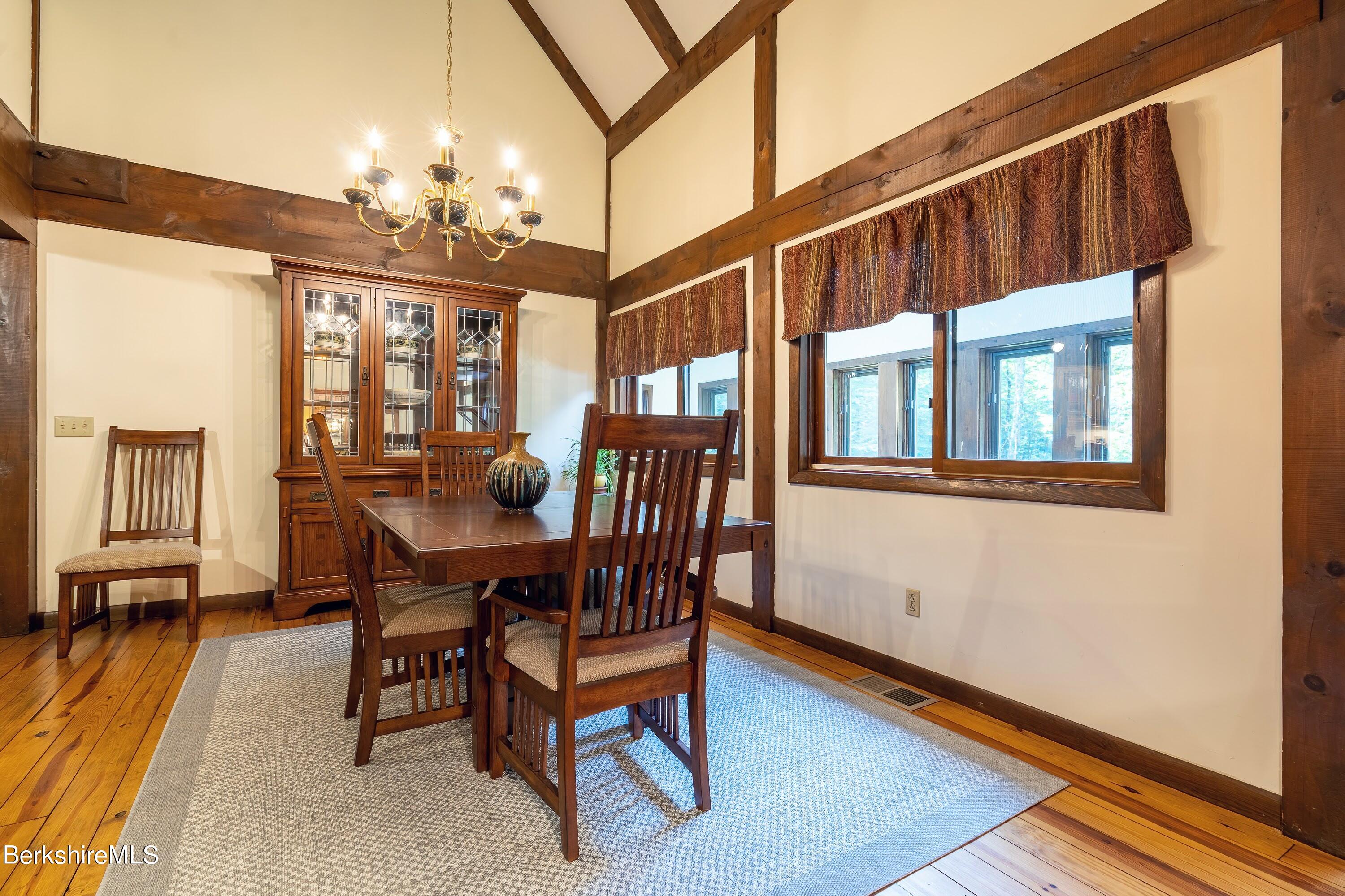 161 Capt Whitney Road Becket, MA 01223 - Photo 8 of 29 a view of a dining room with furniture and chandelier