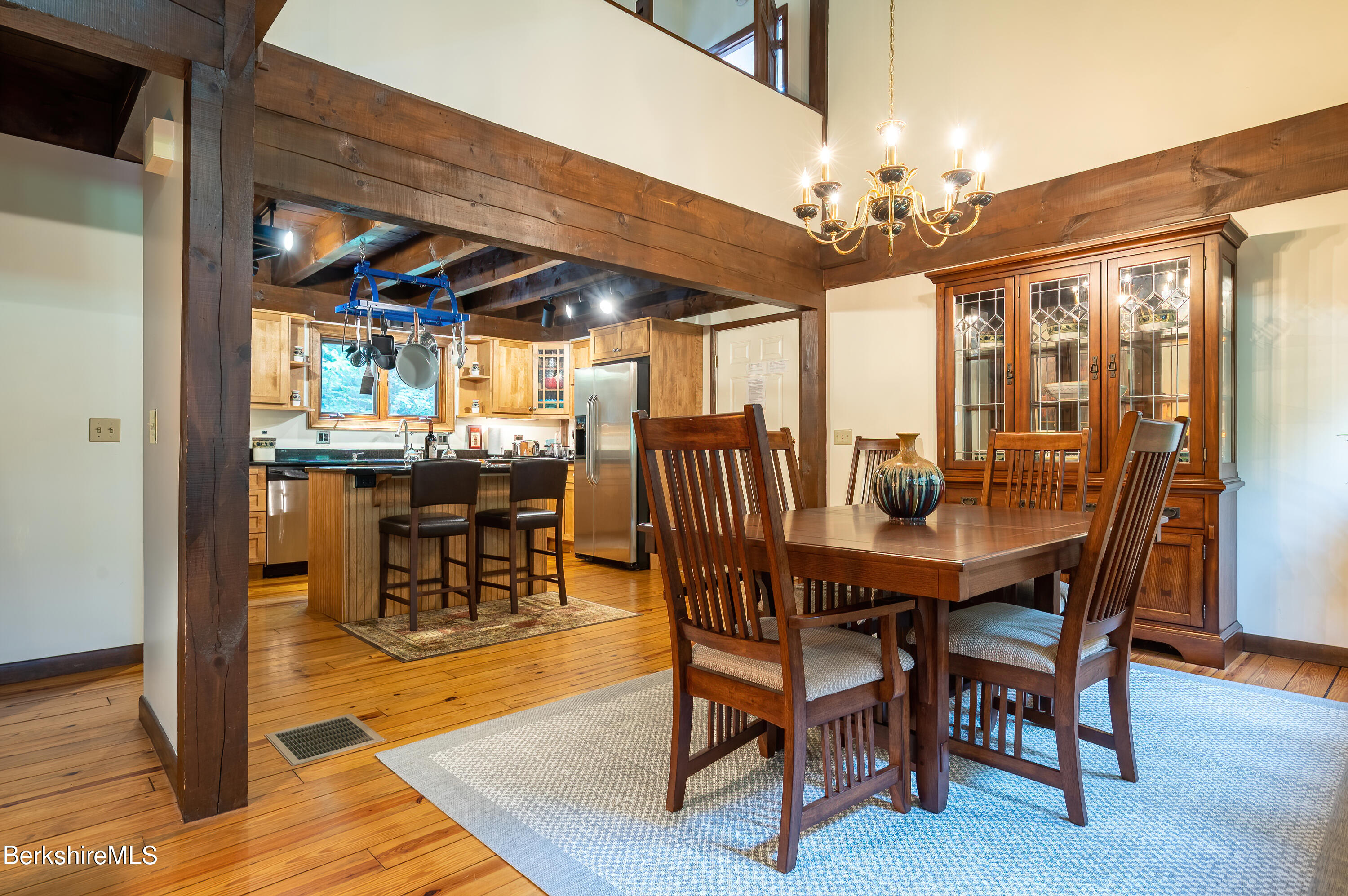 161 Capt Whitney Road Becket, MA 01223 - Photo 9 of 29 a view of a dining room with furniture wooden floor and chandelier