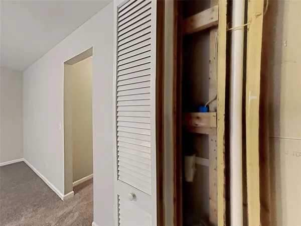 a view of a bedroom from a hallway