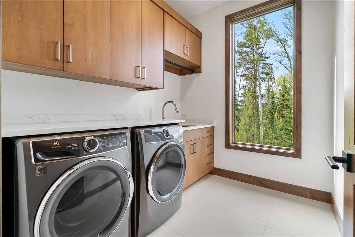1615 Golden Eagle Road Silverthorne, CO 80498 - Photo 32 of 47 a utility room with dryer and washer