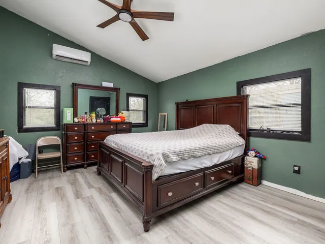 a bed room with a bed window and furniture