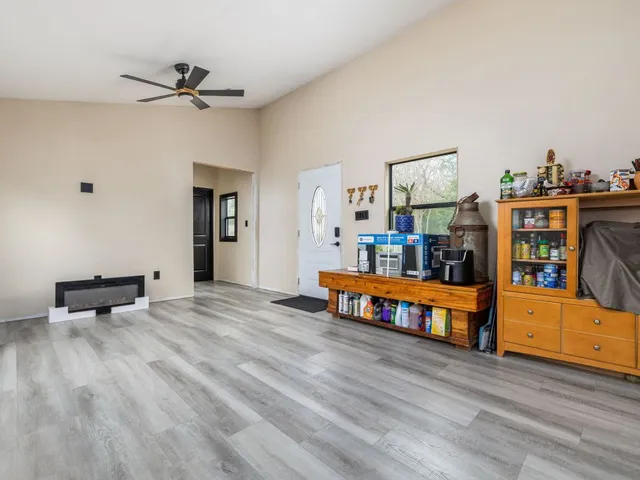 a bedroom with furniture and a wooden floor
