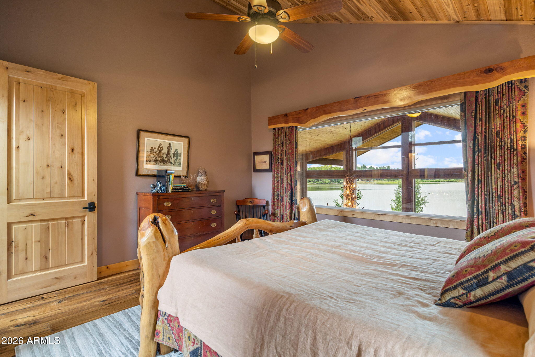 758 Southlake Road Lakeside, AZ 85929 - Photo 37 of 95 a bedroom with a bed and large windows