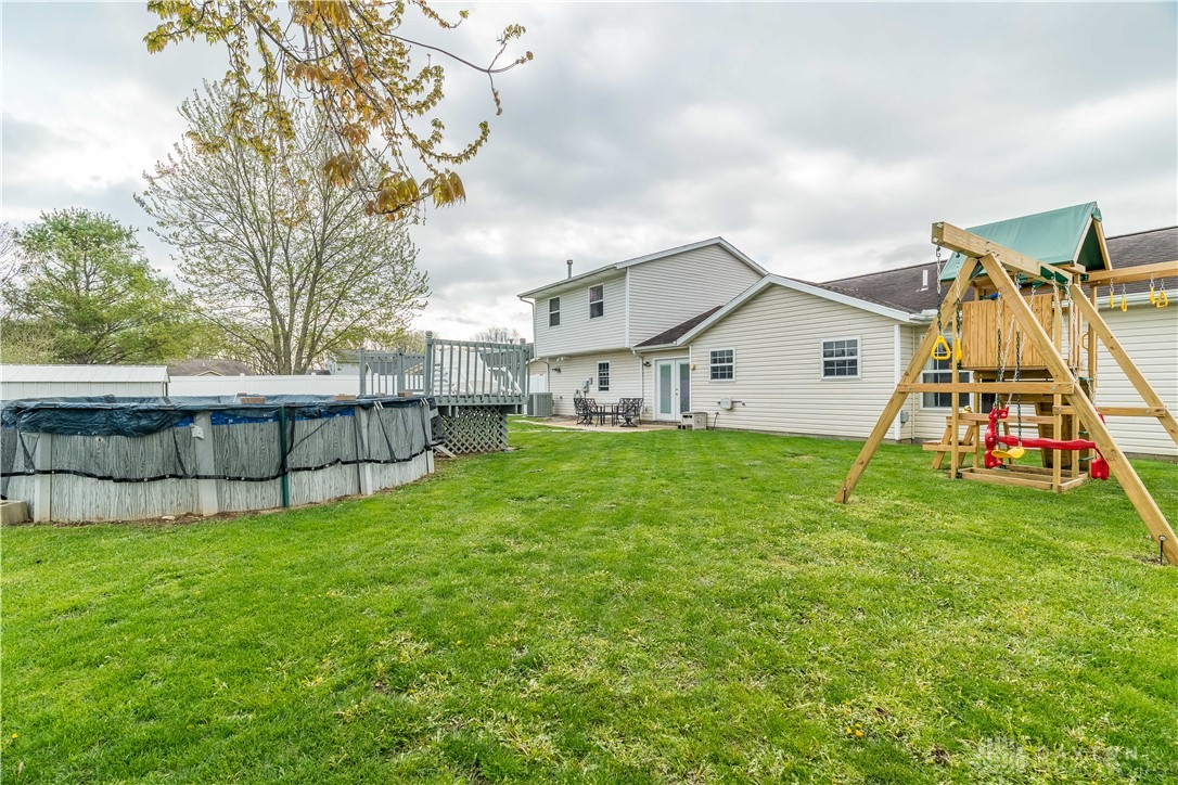 1442 Langdon Road Sidney, OH 45365 - Photo 31 of 34 This spacious backyard offers ample green space and outdoor amenities for recreation and relaxation.
