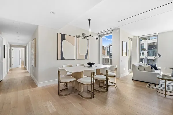 a view of a livingroom with furniture and a table