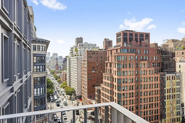 a view of a city with tall buildings