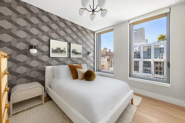 a bedroom with a bed and a couch