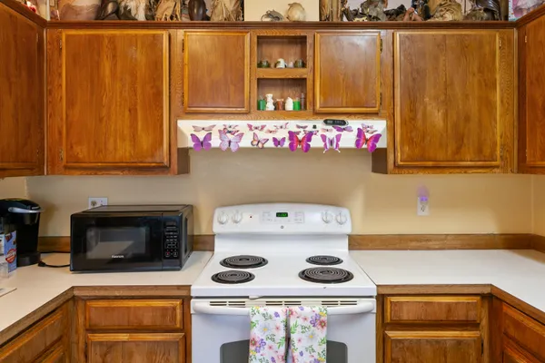 a kitchen with a stove and cabinets
