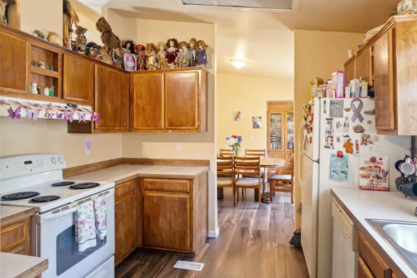 a kitchen with a cabinets and wooden floor