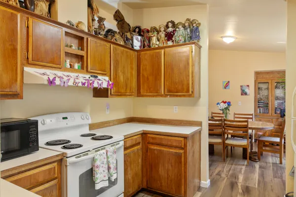 a kitchen with stainless steel appliances granite countertop a stove and a refrigerator