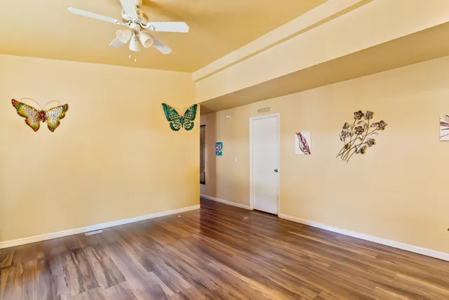 a view of a room with wooden floor and closet