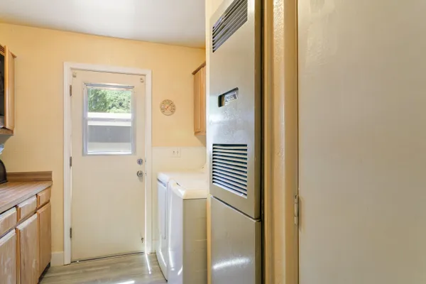 a view of wooden floor and windows in a room