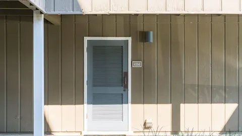 a white building with sign broad